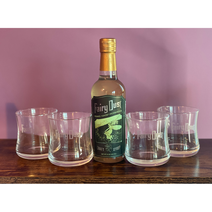 A bottle of Caged Heat or Fairy Dust Cocktail Glasses, Set of 4 with purchase of a bottle!