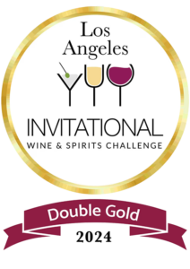 Logo for the Los Angeles Invitational Wine & Spirits Challenge featuring three stylized wine-glass icons forming letters inside a gold circular seal, with the text 'DOUBLE GOLD' on a maroon ribbon and '2024' below.